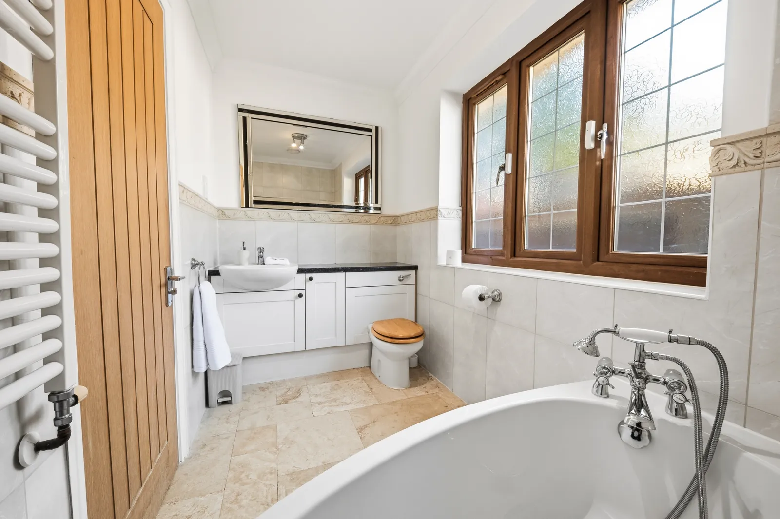 Bathroom with freestanding bath and vanity