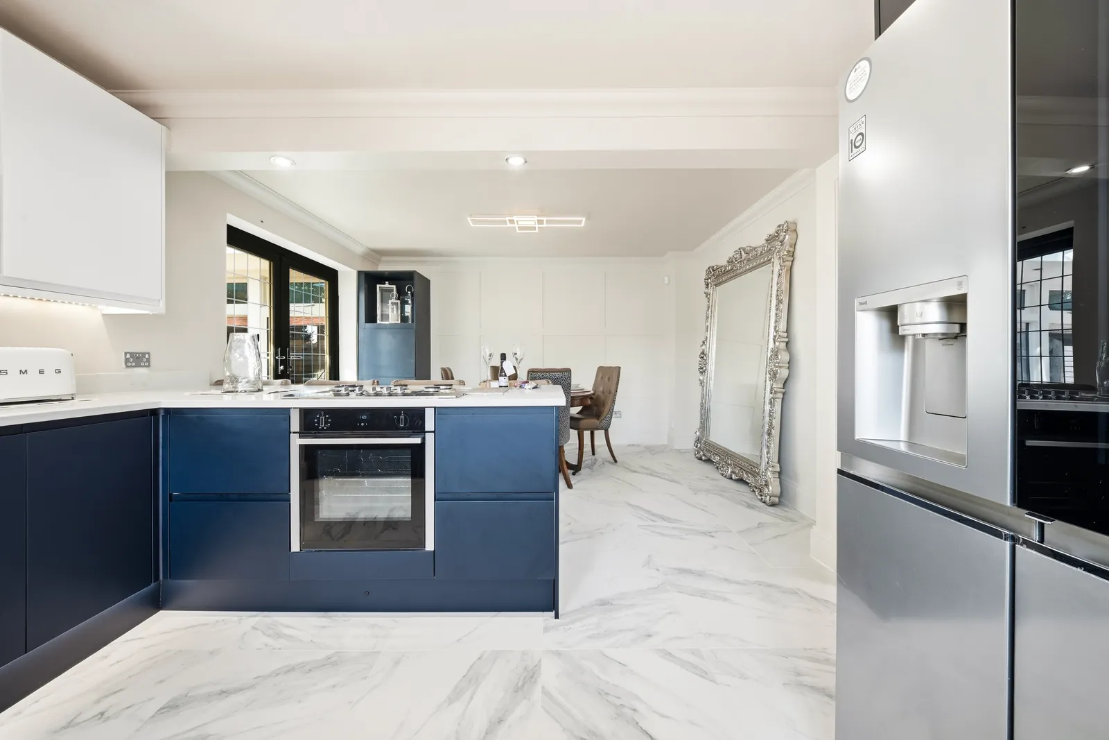 Blue and white open-plan kitchen in a Bournemouth Airbnb