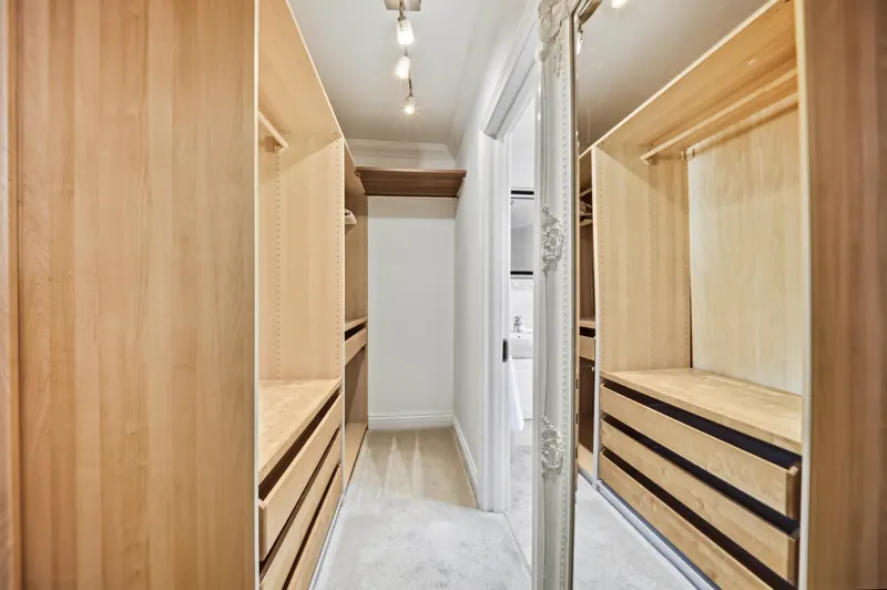 Walk-through dressing room with fitted storage