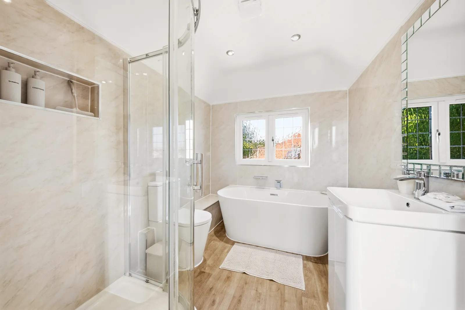 Bright bathroom with walk-in shower and bath