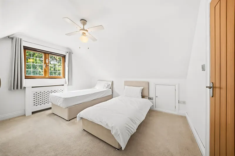 Twin bedroom with neutral styling