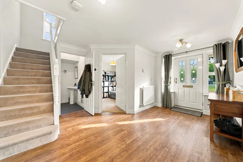 Entrance hall with staircase and doorway to the garden