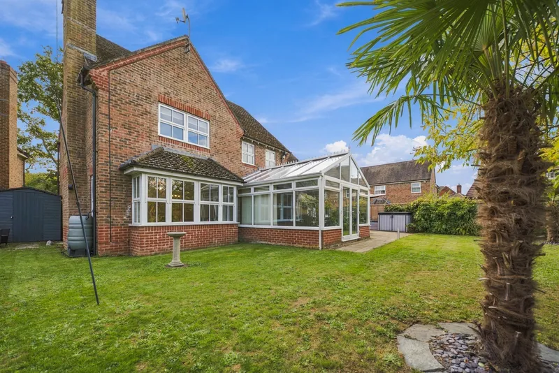 Rear garden, conservatory and the brick exterior of Hardy House