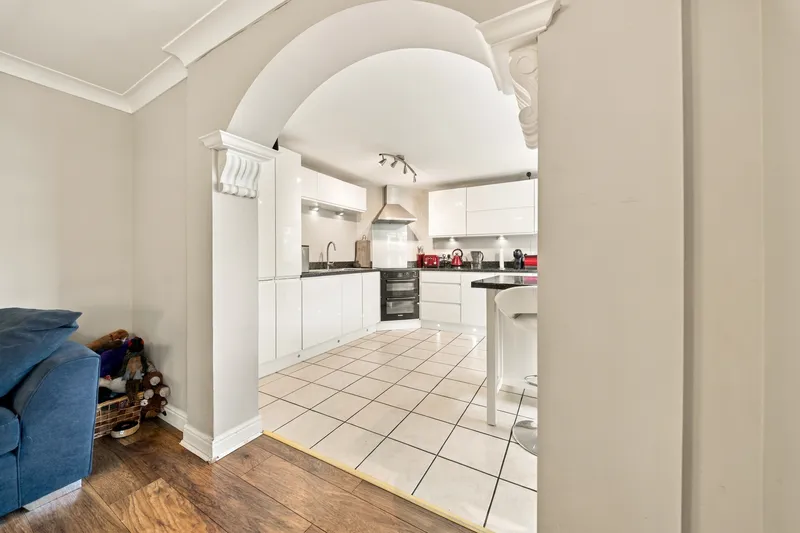 Kitchen and breakfast room seen through the adjoining archway