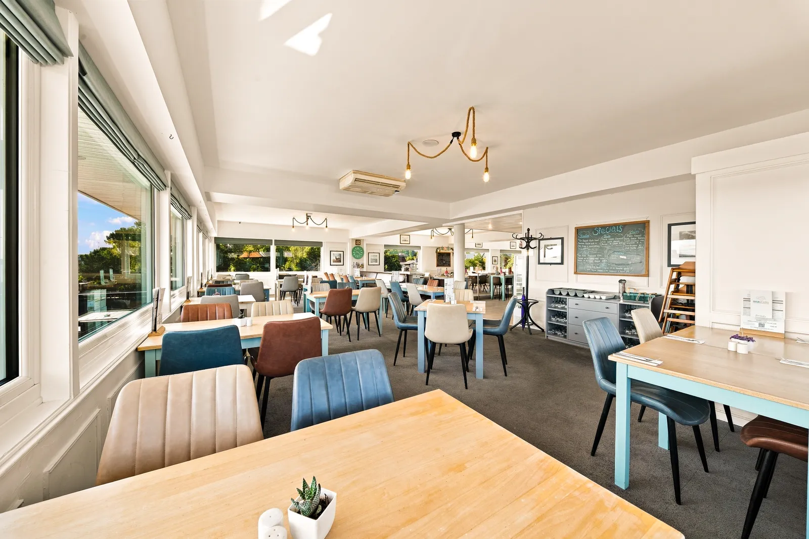Bright dining room facing the water