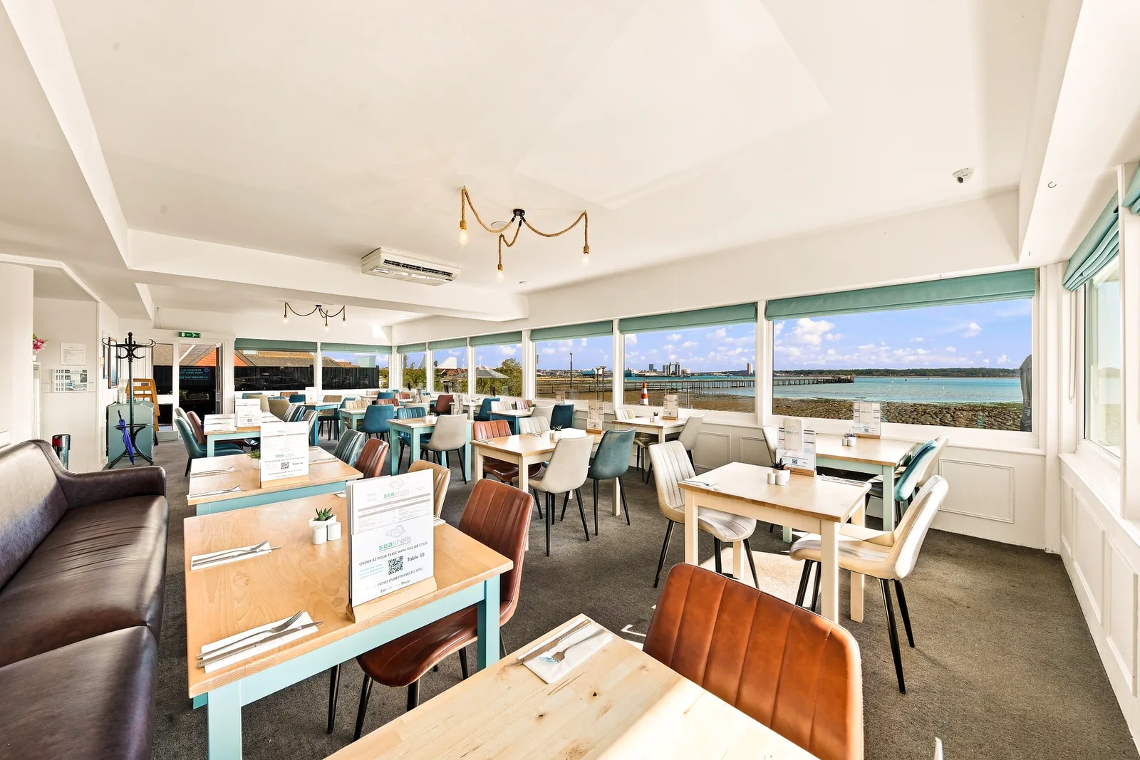 Dining room seating and waterfront outlook