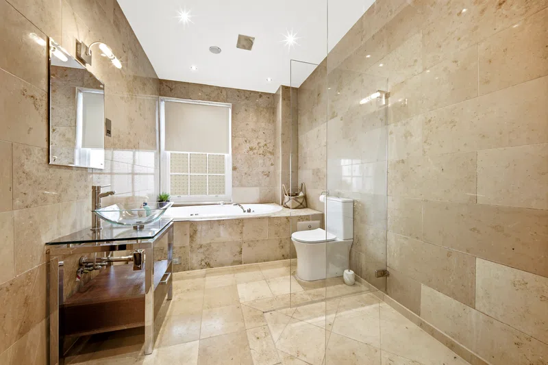 Southampton marble bathroom with bath and walk-in shower photographed for property marketing