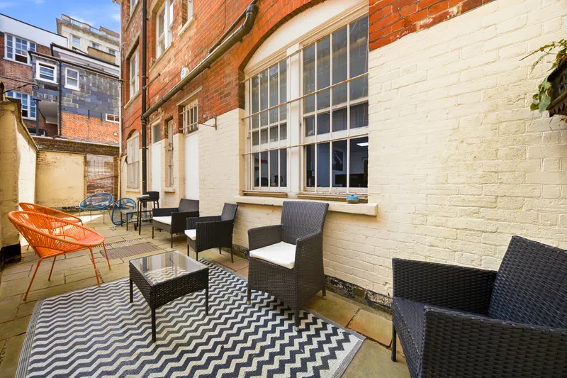 Private courtyard seating area at a Southampton serviced apartment