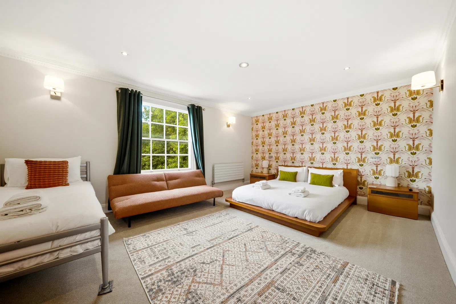 Southampton serviced apartment bedroom with sofa bed and patterned feature wall