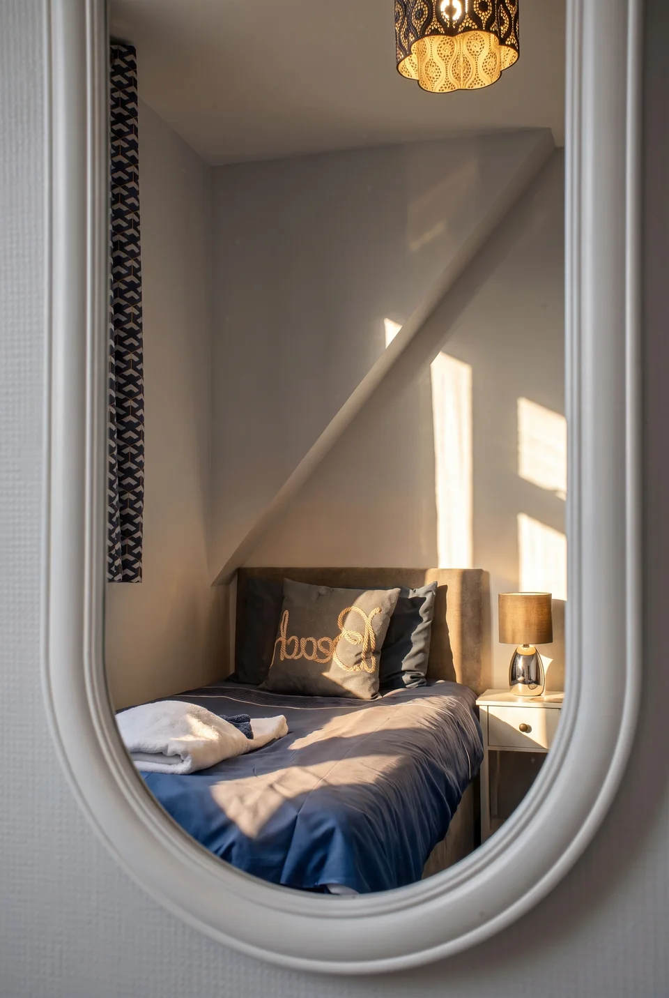 Stylised bedroom mirror detail showing cinematic directional light