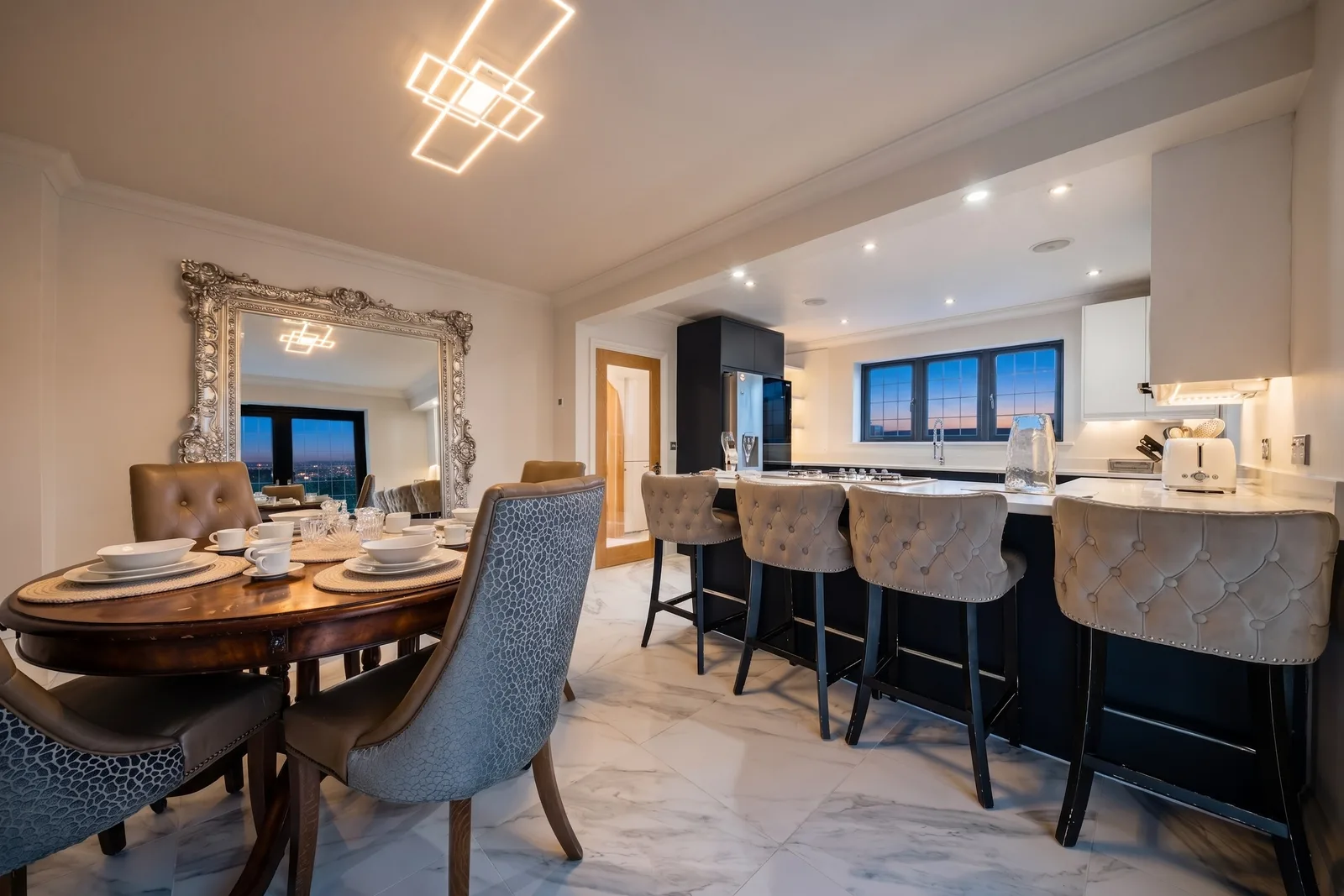 Stylised kitchen and dining area prepared for holiday-let photography