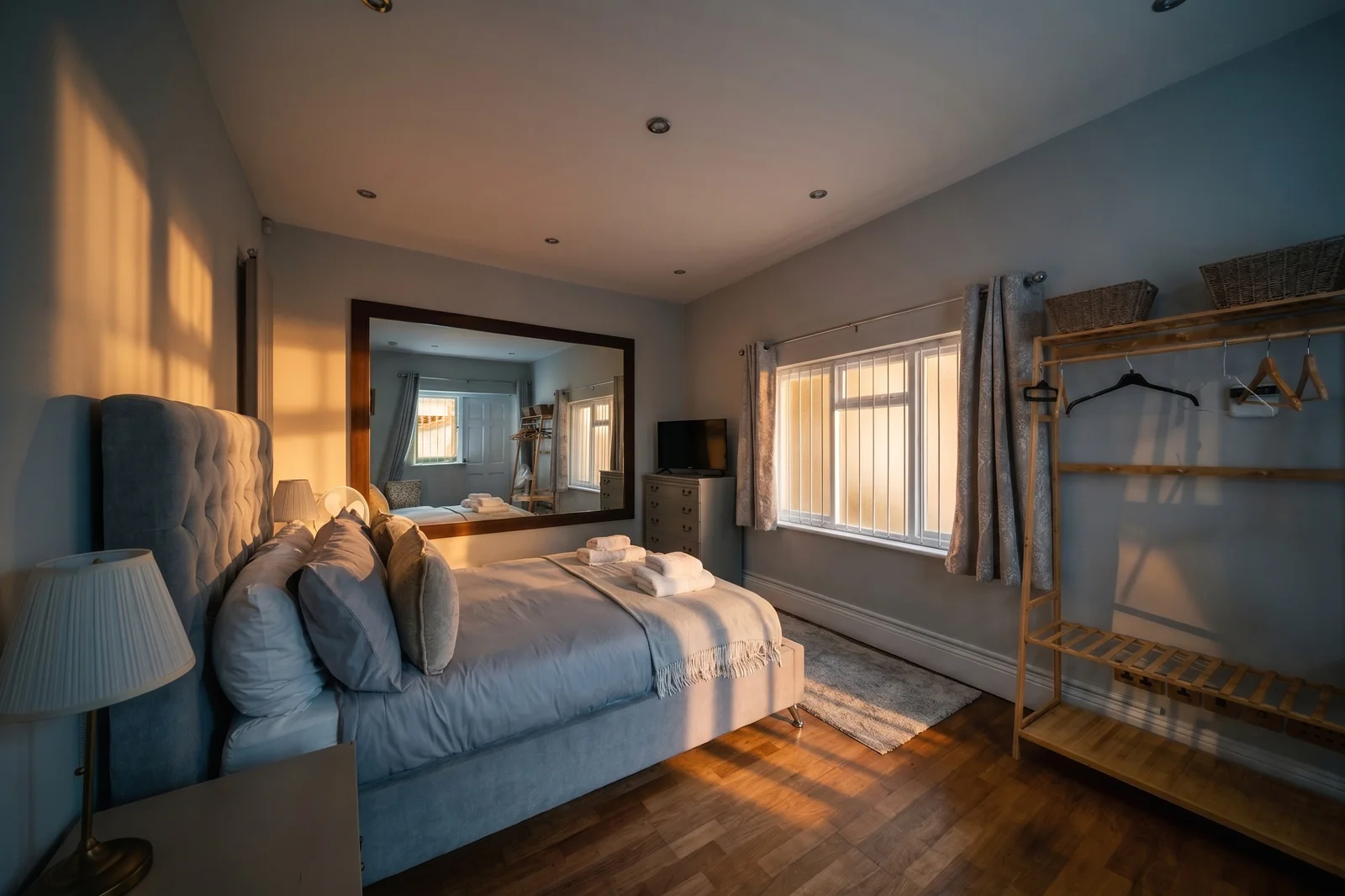 Stylised Southampton serviced apartment bedroom in warm natural light